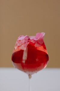 close up on red wine with flower