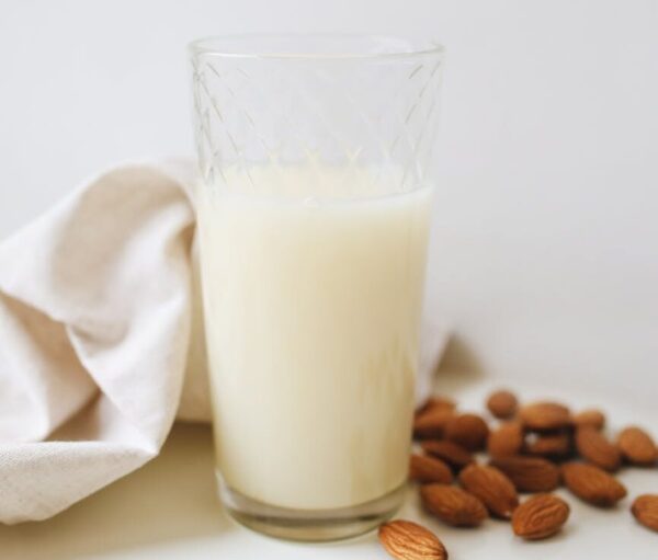 a milk in clear drinking glass